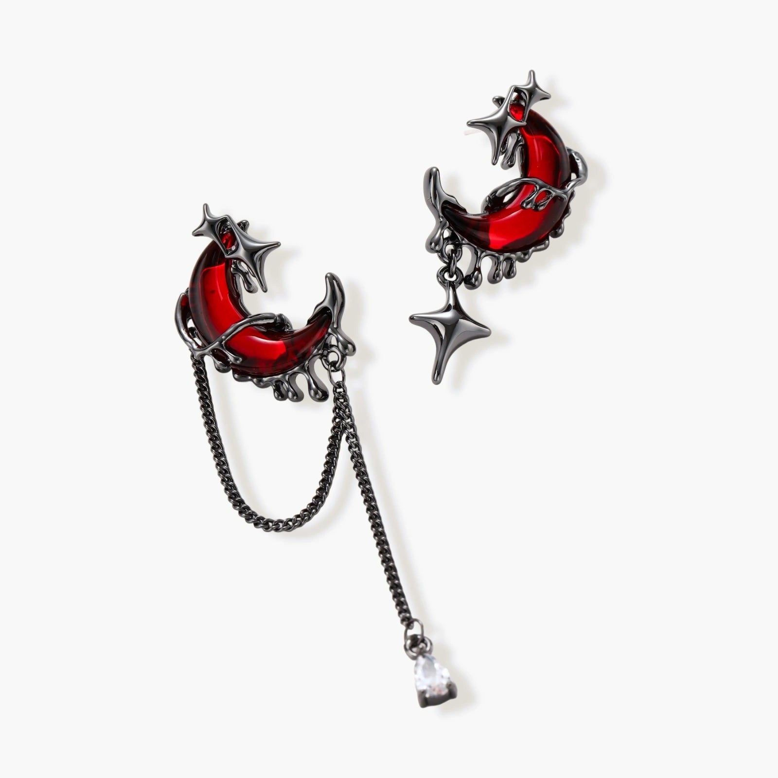Gothic jewelry set with asymmetrical black metal earrings featuring red crescent moons, stars, and layered necklaces with heart pendants